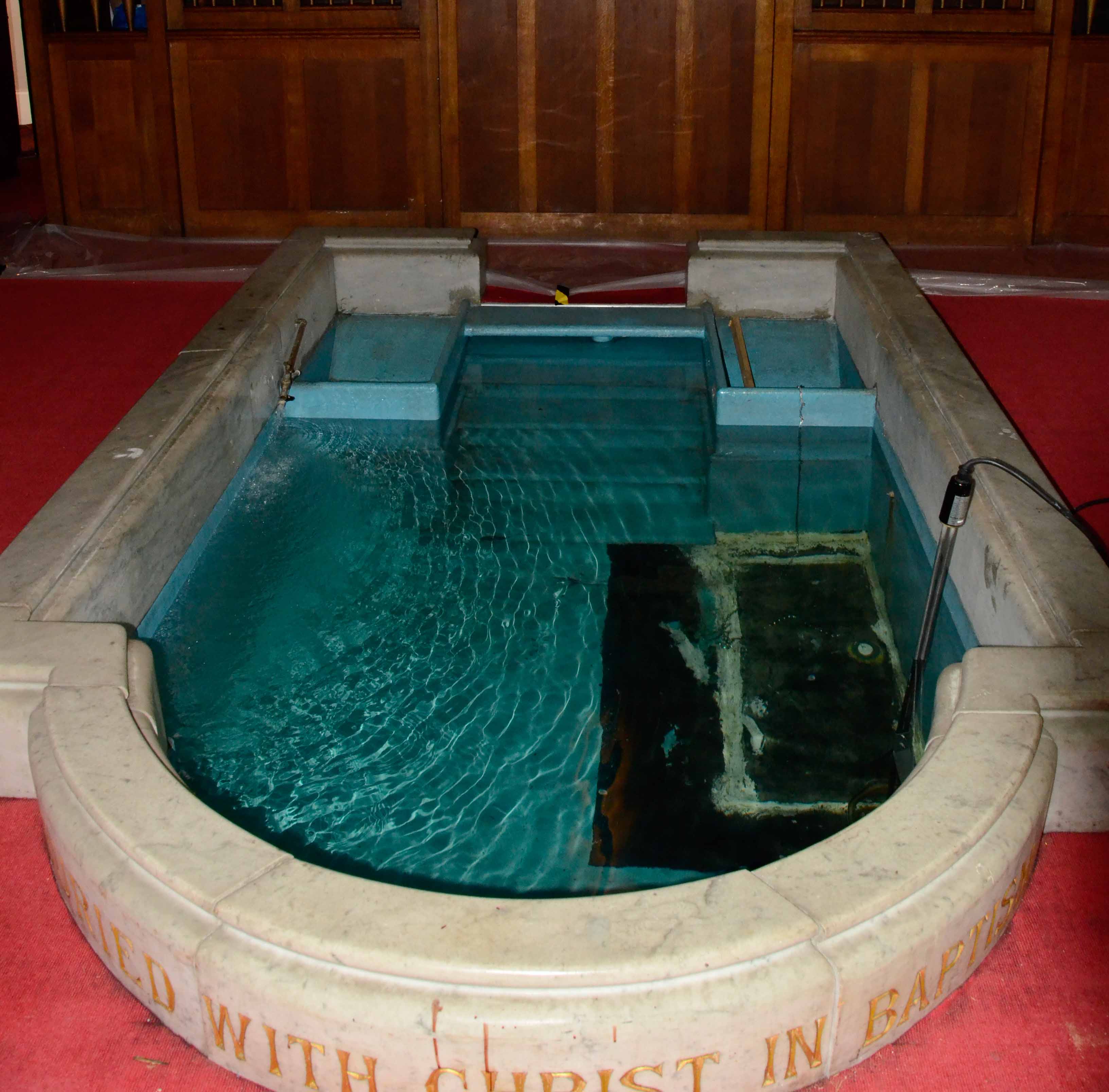 The same baptism pool today, full of water and ready for a baptism service